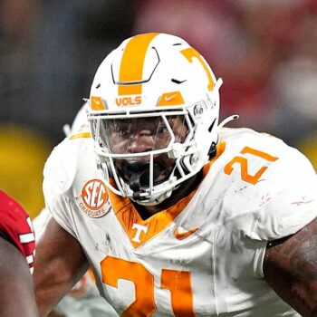 Tennessee player shoves fan storming field to the ground after upset loss to Arkansas