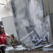 An Israeli firefighter works to put out a fire after a projectile landed at the scene in Kfar Chabad. Pic: Reuters