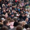 People wear face masks as they walk in Regent Street, in London, Sunday, Nov. 28, 2021. Britain's Prime Minister Boris Johnson said it was necessary to take ...targeted and precautionary measures... after two people tested positive for the new variant in England. He also said mask-wearing in shops and on public transport will be required. (AP Photo/Alberto Pezzali)