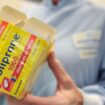 A person poses with boxes of Doliprane, a French over-the-counter drug containing paracetamol, on October 28, 2009 at French pharmaceutical group Sanofi-Aventis site in Lisieux, northern France. The site, created in 1982, is dedicated to the production of medicine containing paracetamol. AFP PHOTO MYCHELE DANIAU