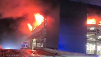 Handout screen grab from video issued by Bedfordshire Fire and Rescue Service a fire at a car park at Luton Airport On Tuesday. All flights at the airport have been suspended. Issue date: Wednesday October 11, 2023.