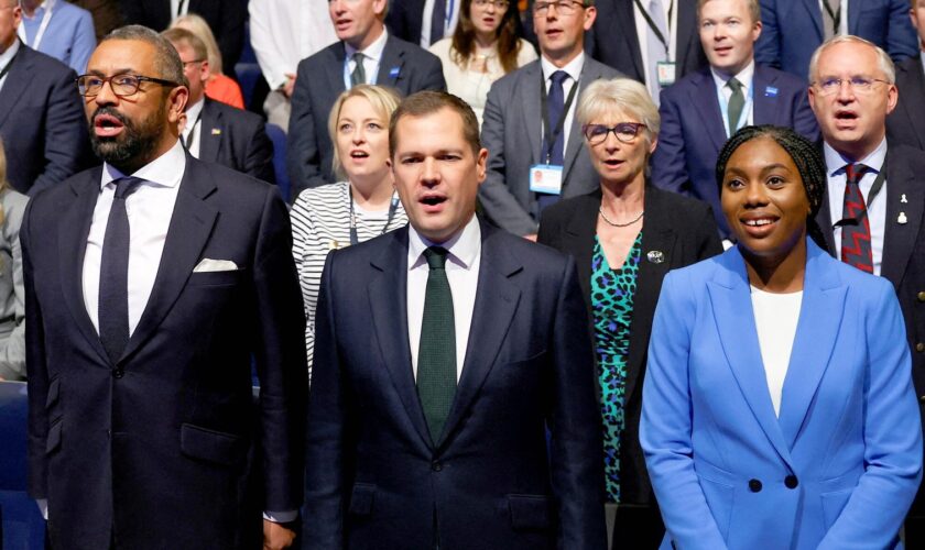 Conservative MPs and leadership candidates, Tom Tugendhat, Shadow Home Secretary James Cleverly, Robert Jenrick and Kemi Badenoch sing the national anthem on the final day of the Conservative Party conference in Birmingham, Britain, October 2, 2024. REUTERS/Toby Melville