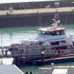 A group of people thought to be migrants are brought in to Dover, Kent, from a Border Force vessel on 18 October. Pic: PA