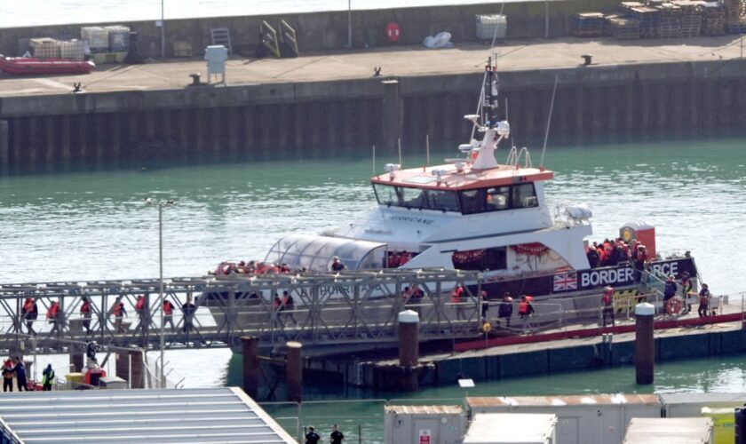 A group of people thought to be migrants are brought in to Dover, Kent, from a Border Force vessel on 18 October. Pic: PA