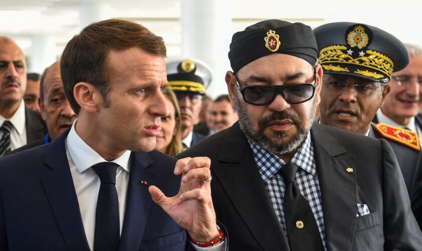 French President Emmanuel Macron (C-L) gestures as he speaks with Morocco's King Mohamed VI (C-R) upon their arrival at Rabat Agdal train station for the inauguration of a high-speed railway line on November 15, 2018. French President Emmanuel Macron visits Morocco to take part in the inauguration of a high-speed railway line that boasts the fastest journey times in Africa or the Arab world. (Photo by FADEL SENNA / AFP)