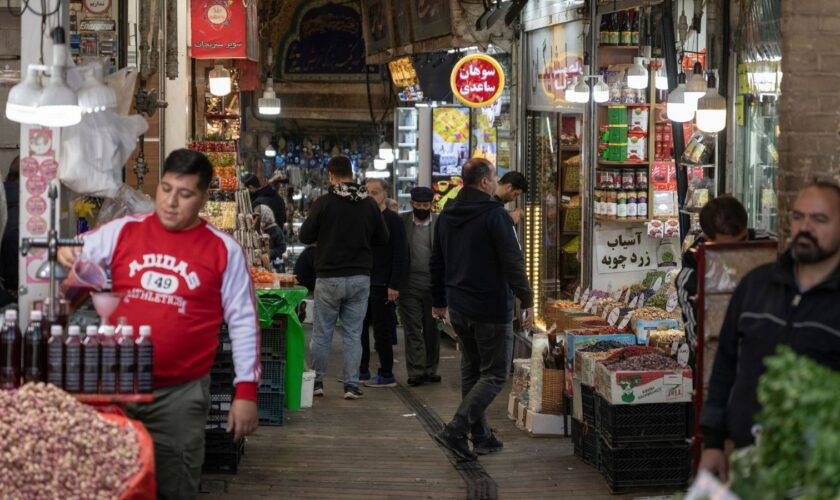 People go about their daily lives after the Israeli retaliatory strike in Iran. The airstrike has left many of the country's inhabitants undaunted. Pic: AP