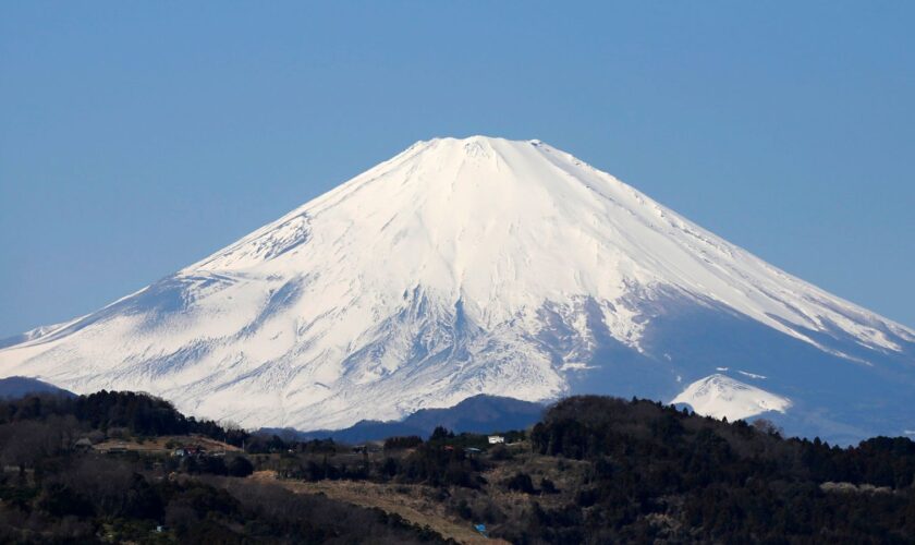 Japan's Mount Fuji is seen covered with snow from Nakai town, Kanagawa prefecture, Japan, March 1, 2016. REUTERS/Issei Kato