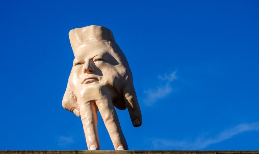 A New Zealand city waves goodbye to its giant hand sculpture that many came to love