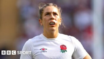 Holly Aitchison running with the ball while playing for England