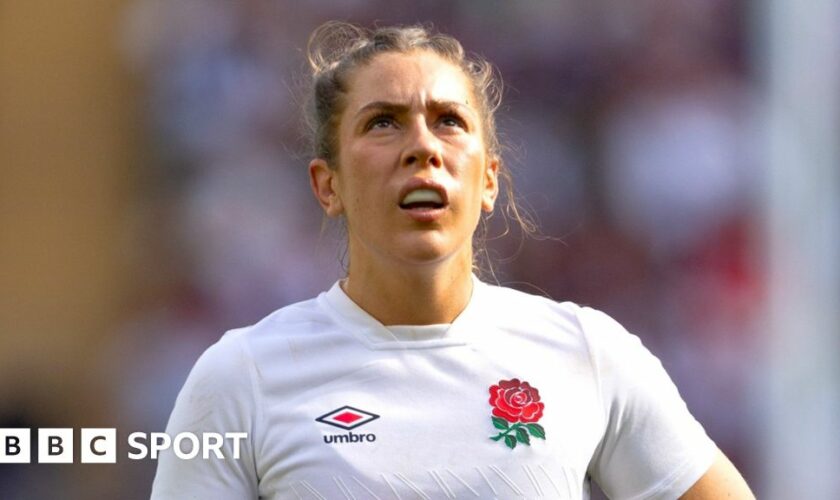 Holly Aitchison running with the ball while playing for England