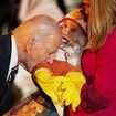 Biden bites a baby's leg and Jill wears a full Panda suit as White House goes spooky for trick-or-treating