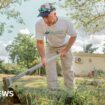 Keeping lawns neat in front of burned homes - a year on at kibbutz where Hamas killed 101