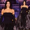 Kylie Jenner shuts down Disneyland Paris! Reality star channels her inner villain in a dramatic black satin gown as she graces the catwalk for Coperni's magical Princess Collection