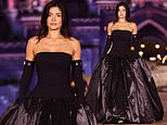 Kylie Jenner shuts down Disneyland Paris! Reality star channels her inner villain in a dramatic black satin gown as she graces the catwalk for Coperni's magical Princess Collection