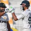 Pakistan's Abdullah Shafique celebrates with his captain Shan Masood after scoring a century during the first day of the first Test between Pakistan and England at the Multan Cricket Stadium