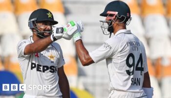 Pakistan's Abdullah Shafique celebrates with his captain Shan Masood after scoring a century during the first day of the first Test between Pakistan and England at the Multan Cricket Stadium