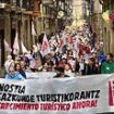 Moment hundreds of 'anti-tourist' activists storm the streets of Spain in protest amid wave of campaigning to try to keep holidaymakers away