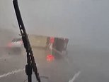 Most shocking moments from Spain's flood disaster caught on camera: Lorry is overturned in torrential downpour, woman is airlifted from deep water with her dog and bridge is swept away in apocalyptic scenes