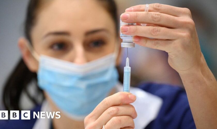 A woman receives the Covid vaccine