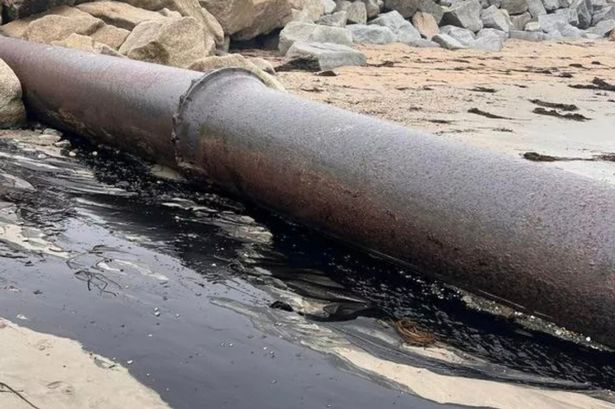 Pipe leaking 'absolutely stinking' liquid on Cornwall beach investigated by Environment Agency