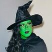 Singer looks unrecognisable as they dress as Wicked witch Elphaba complete with a green face for 'spooktacular' Halloween event - but can you guess who?