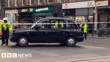 Three people in hospital after taxi hits pedestrians