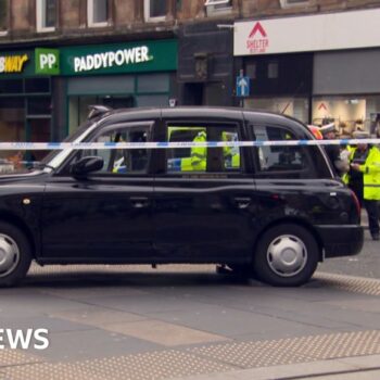 Three people in hospital after taxi hits pedestrians