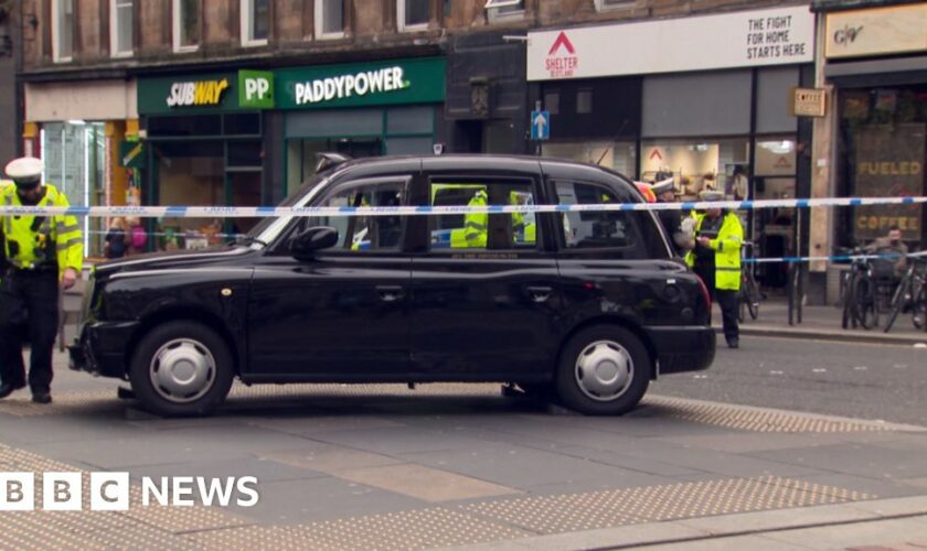 Three people in hospital after taxi hits pedestrians