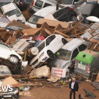 Watch: Drivers rescued after floodwaters cause chaos in Spain