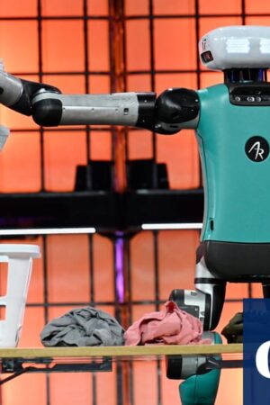 ‘A fork in the road’: laundry-sorting robot spurs AI hopes and fears at Europe’s biggest tech event