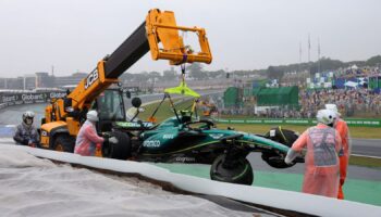 Aston Martin's Fernando Alonso car is towed away after crashing out during qualifying. Pic: Reuters