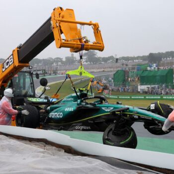 Aston Martin's Fernando Alonso car is towed away after crashing out during qualifying. Pic: Reuters