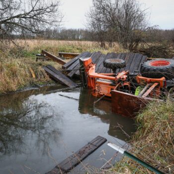 Illinois man rescued after bridge collapse causes tractor to trap him in creek