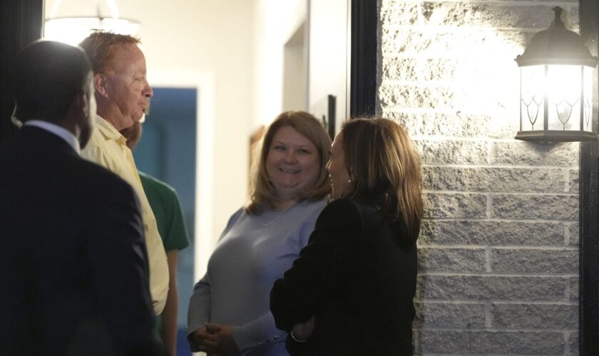 Harris greets Pennsylvania family on porch, suggests staging 'door knock'