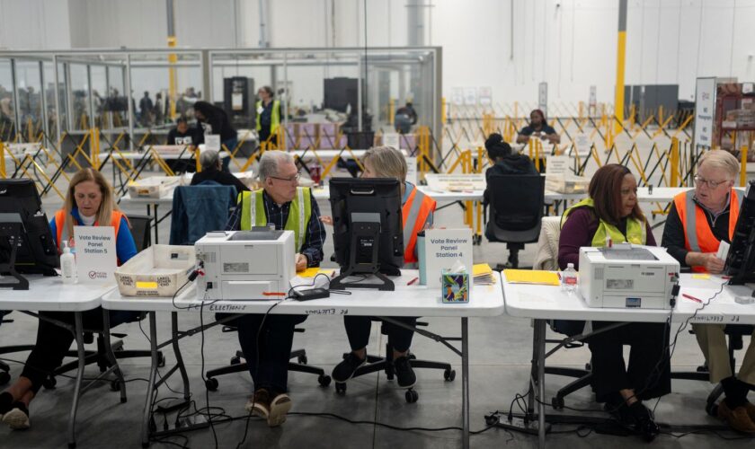 Fulton County officials count votes near Atlanta. Pic: Reuters