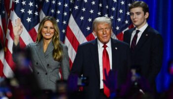 Republican presidential nominee and former U.S. President Donald Trump takes the stage with his wife Melania and his son Barron following early results from the 2024 U.S. presidential election in Palm Beach County Convention Center, in West Palm Beach, Florida, U.S., November 6, 2024. REUTERS/Callaghan O'Hare