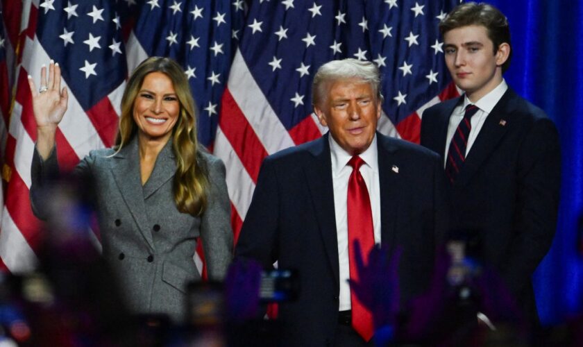 Republican presidential nominee and former U.S. President Donald Trump takes the stage with his wife Melania and his son Barron following early results from the 2024 U.S. presidential election in Palm Beach County Convention Center, in West Palm Beach, Florida, U.S., November 6, 2024. REUTERS/Callaghan O'Hare