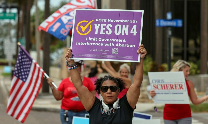 Beth Weinstein rallies in supporter of Yes on Amendment 4 regarding abortion in Florida outside of the polling place at the courthouse on Tuesday, Nov. 5, 2024, in Clearwater, Fla. (AP Photo/Mike Carlson)