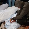 A man reacts next to the bodies of Palestinians killed in Israeli strikes in February. Pic: Reuters