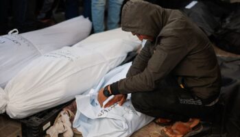 A man reacts next to the bodies of Palestinians killed in Israeli strikes in February. Pic: Reuters