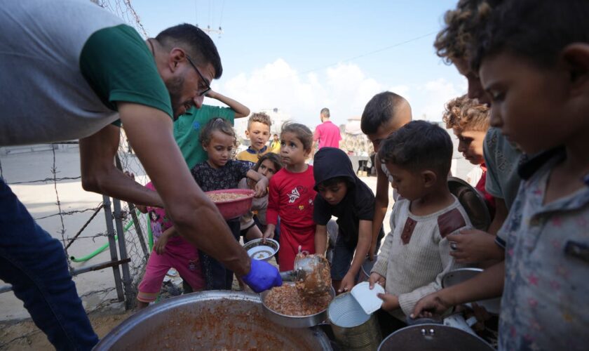 Hungry Palestinians in north Gaza search for food, sealed off from aid for a month by Israeli siege