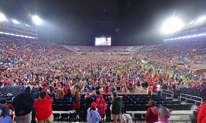 Ole Miss fans storm field with time remaining on clock, prompting delay to game's end