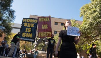 Texas campus in uproar after protesters hold signs declaring ‘women are property’ on quad after Trump victory