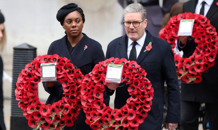 Conservative Party leader Kemi Badenoch and Britain's Prime Minister Keir Starmer carry wreaths during the National Service of Remembrance at The Cenotaph in London, Britain, November 10, 2024. Chris Jackson/Pool via REUTERS