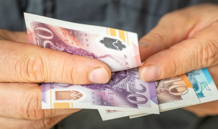 A file picture of someone counting money. Pic: iStock