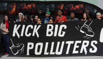 Activists participate in a demonstration against fossil fuels at the COP29 U.N. Climate Summit, Friday, Nov. 15, 2024, in Baku, Azerbaijan. (AP Photo/Joshua A. Bickel)