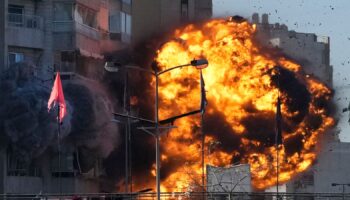 Smoke and flames erupt from a building hit in an Israeli airstrike in Tayouneh, Beirut, Lebanon, Friday, Nov. 15, 2024. (AP Photo/Hassan Ammar)