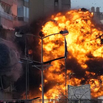 Smoke and flames erupt from a building hit in an Israeli airstrike in Tayouneh, Beirut, Lebanon, Friday, Nov. 15, 2024. (AP Photo/Hassan Ammar)