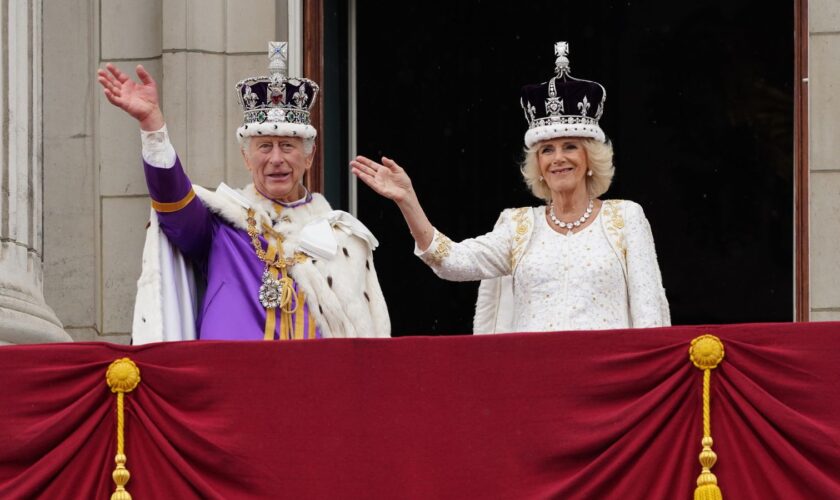 King Charles III and Queen Camilla on the balcony of Buckingham Palace, London, following the coronation. Picture date: Saturday May 6, 2023.