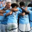 Manchester City FC players huddle up before a soccer game against AC Milan, Saturday, July 27, 2024, in New York. (AP Photo/Pamela Smith)